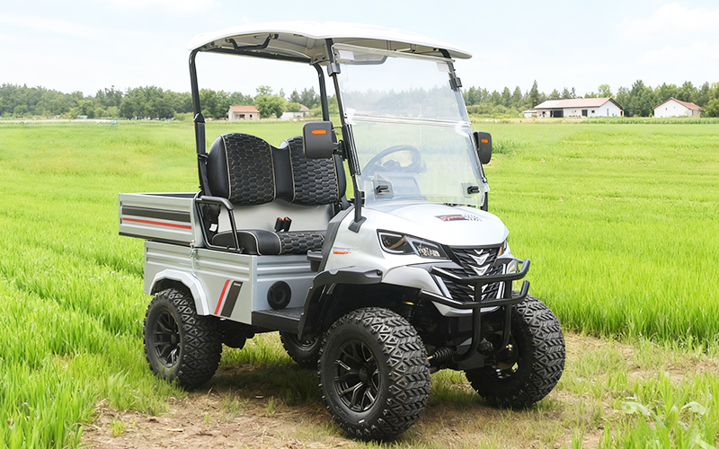 Rugged utility vehicle with cargo bed for farm and ranch work