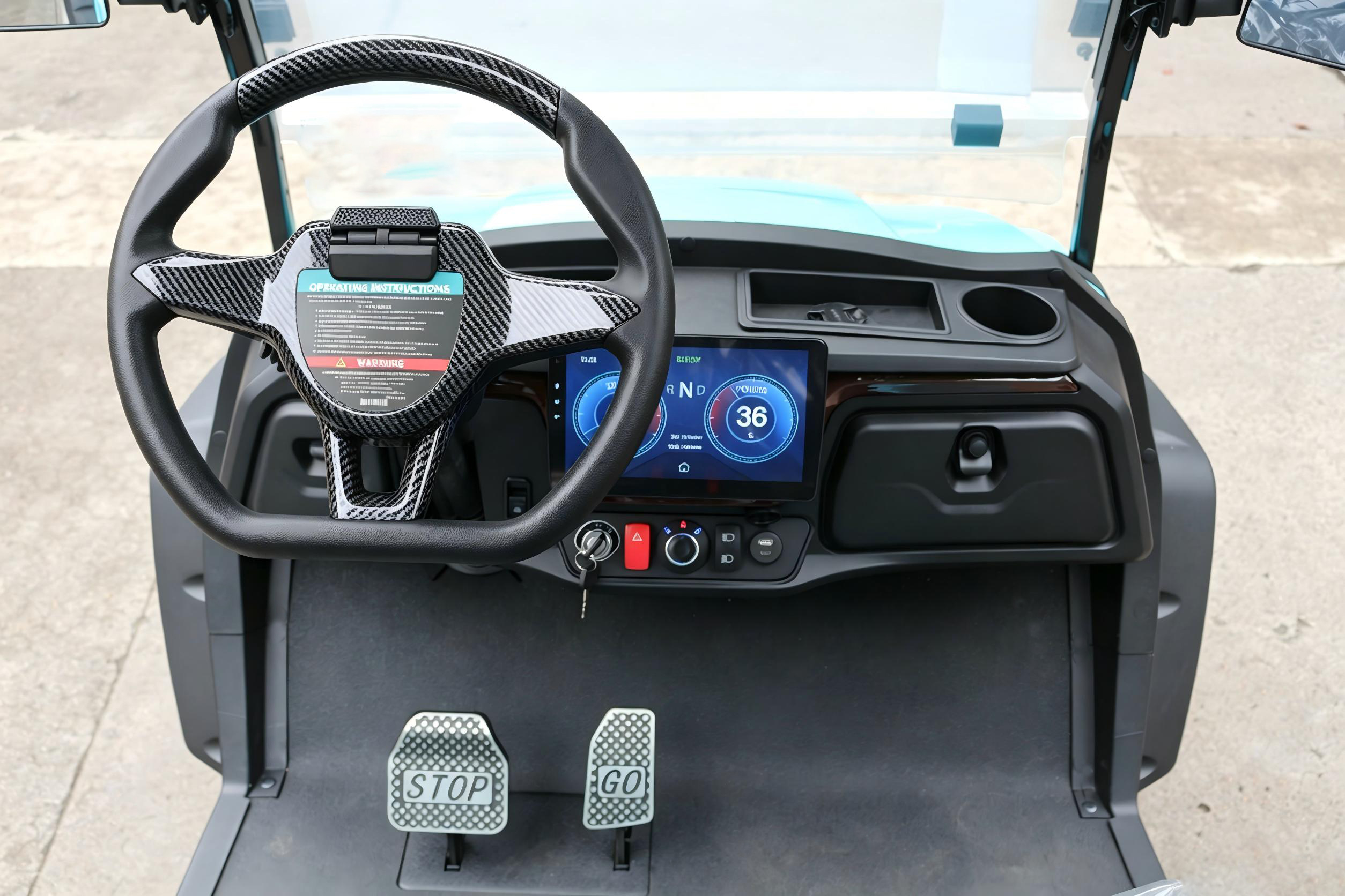 Luxury Golf Buggy SH-CY020T dashboard featuring carbon fiber texture steering wheel, digital display, and ergonomic STOP/GO pedals